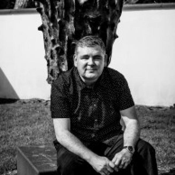 Darren Shan sitting outside