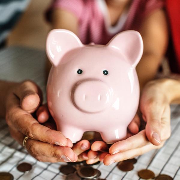 Woman holding a piggy bank