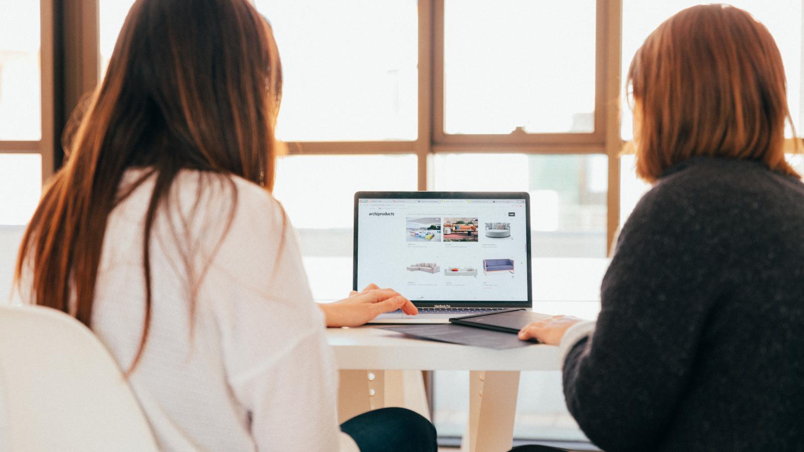 Two women at a laptop