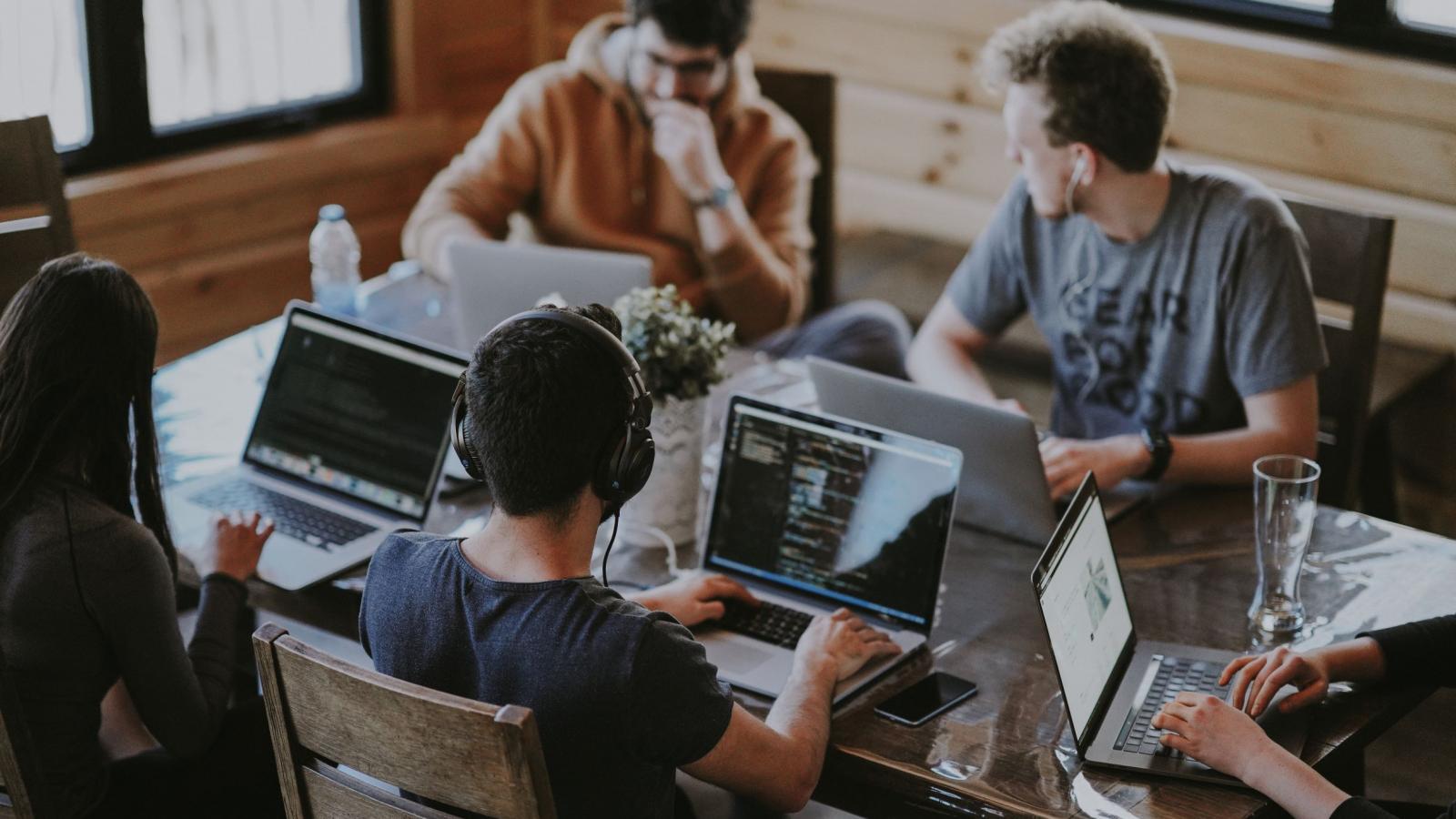 A team of people working around a table