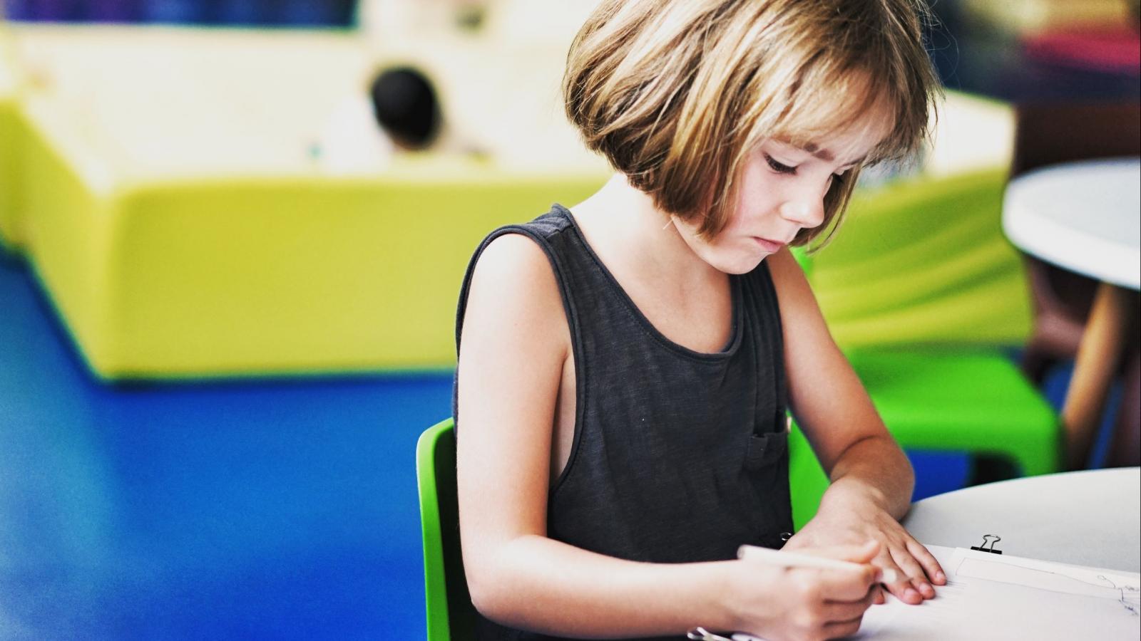 Young girl working at a table